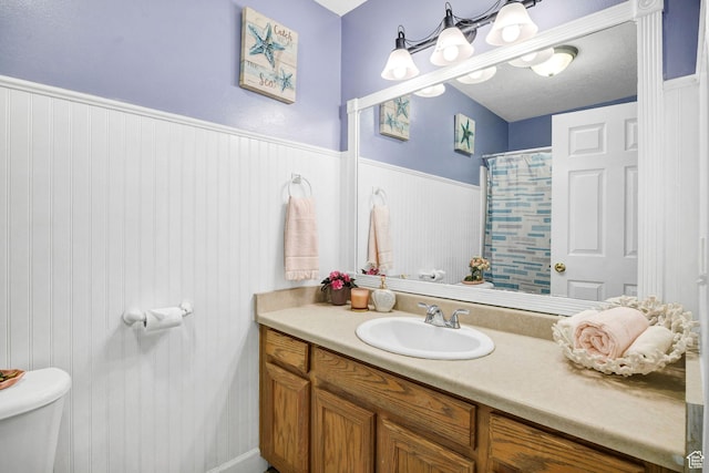 232 Sunstone Cir W, Logan, UT 84321 - full bath featuring vanity, wainscoting, and a shower with curtain