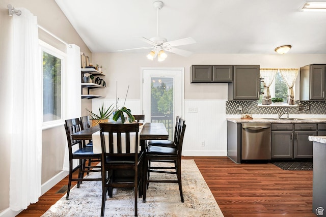 232 Sunstone Cir W, Logan, UT 84321 - dining room with dark wood-style flooring, ceiling fan, and wainscoting