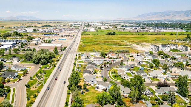232 Sunstone Cir W, Logan, UT 84321 - aerial overview of property's location with a mountain backdrop and nearby suburban area