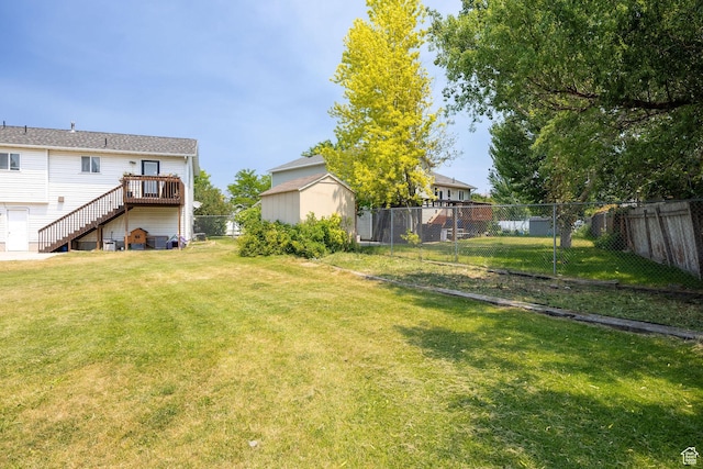 232 Sunstone Cir W, Logan, UT 84321 - fenced backyard featuring stairs and a wooden deck