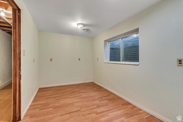 6074 W Wending Ln, West Valley City, UT 84128 - unfurnished room with light wood-style floors