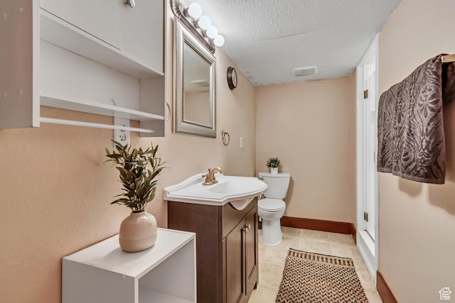 6074 W Wending Ln, West Valley City, UT 84128 - bathroom featuring vanity, a textured ceiling, and tile patterned floors