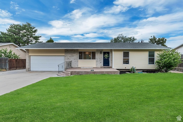 6074 W Wending Ln, West Valley City, UT 84128 - ranch-style house featuring an attached garage, concrete driveway, brick siding, and a shingled roof