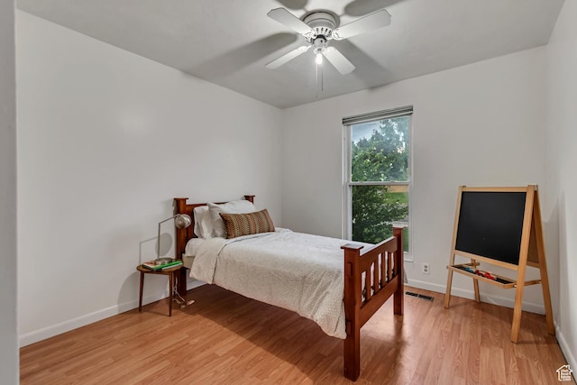 6074 W Wending Ln, West Valley City, UT 84128 - bedroom featuring light wood-style floors and ceiling fan