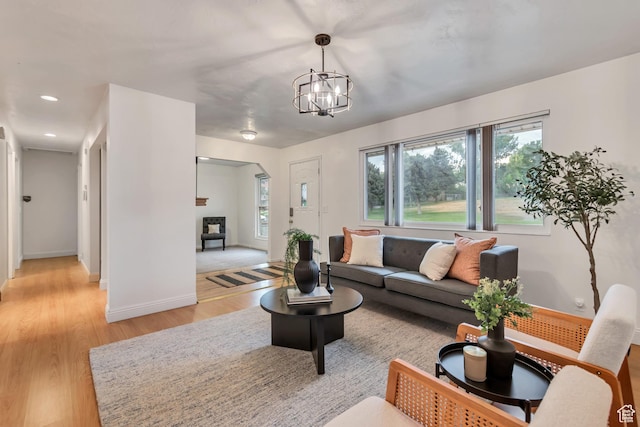 6074 W Wending Ln, West Valley City, UT 84128 - living room with light wood-style flooring, plenty of natural light, a chandelier, and recessed lighting
