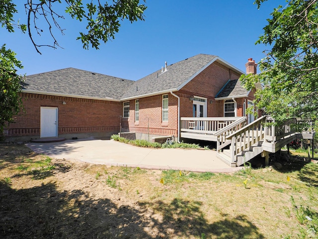 1539 S 50 E, Salem, UT 84653 - rear view of property with a patio, brick siding, a wooden deck, a shingled roof, and a chimney