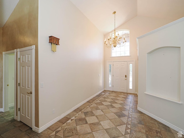 1539 S 50 E, Salem, UT 84653 - foyer entrance featuring high vaulted ceiling, a chandelier, and stone tile flooring