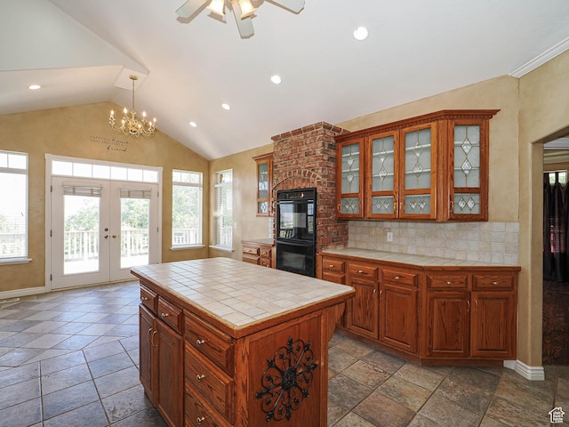 1539 S 50 E, Salem, UT 84653 - kitchen featuring tile counters, lofted ceiling, healthy amount of natural light, french doors, and backsplash