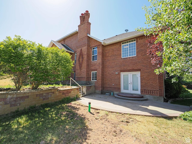 1539 S 50 E, Salem, UT 84653 - back of property featuring french doors, a patio area, a chimney, and brick siding