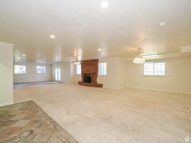 1539 S 50 E, Salem, UT 84653 - unfurnished living room with recessed lighting, healthy amount of natural light, a fireplace, a ceiling fan, and carpet