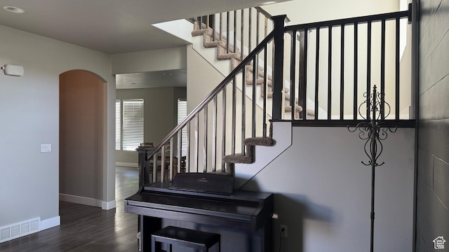 559 E Petersen Pkwy, South Weber, UT 84405 - staircase with wood finished floors, arched walkways, and recessed lighting