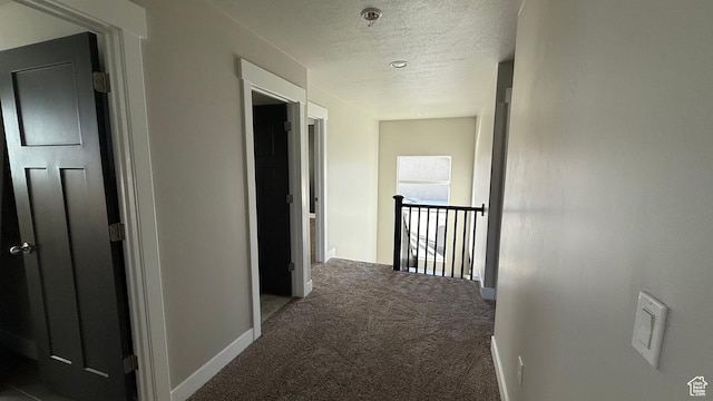 559 E Petersen Pkwy, South Weber, UT 84405 - corridor featuring carpet floors, a textured ceiling, and an upstairs landing