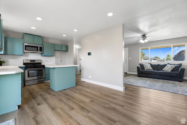 271 S Barratt Cir, American Fork, UT 84003 - kitchen featuring appliances with stainless steel finishes, open floor plan, green cabinets, recessed lighting, and light countertops