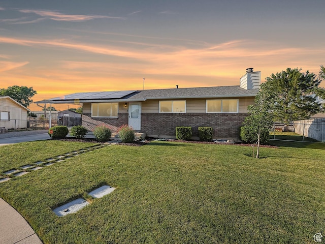 271 S Barratt Cir, American Fork, UT 84003 - view of front of home with brick siding, solar panels, and a chimney
