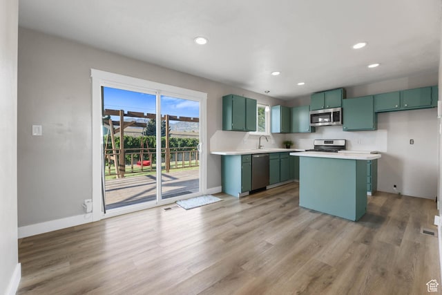 271 S Barratt Cir, American Fork, UT 84003 - kitchen with green cabinetry, stainless steel appliances, light wood-style floors, light countertops, and recessed lighting