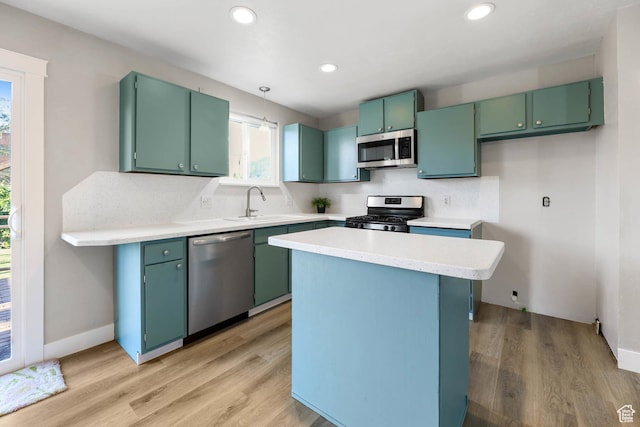 271 S Barratt Cir, American Fork, UT 84003 - kitchen with stainless steel appliances, light wood finished floors, light countertops, recessed lighting, and a center island