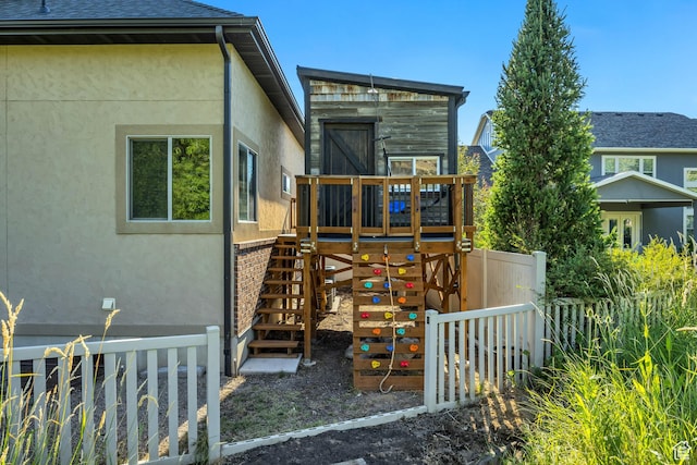 789 Eliza Ct, Farmington, UT 84025 - rear view of house with stucco siding and a playground