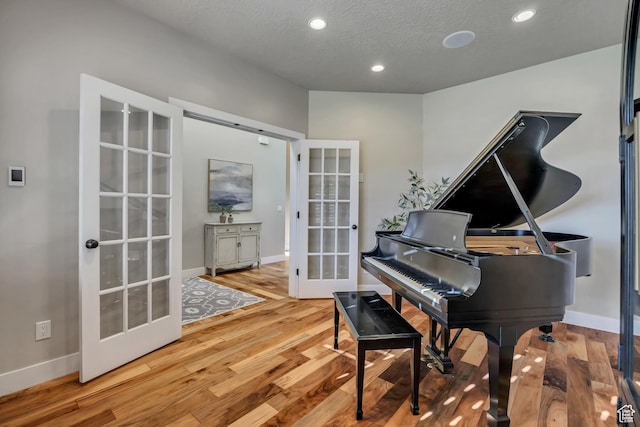 789 Eliza Ct, Farmington, UT 84025 - sitting room with french doors, wood finished floors, recessed lighting, and a textured ceiling