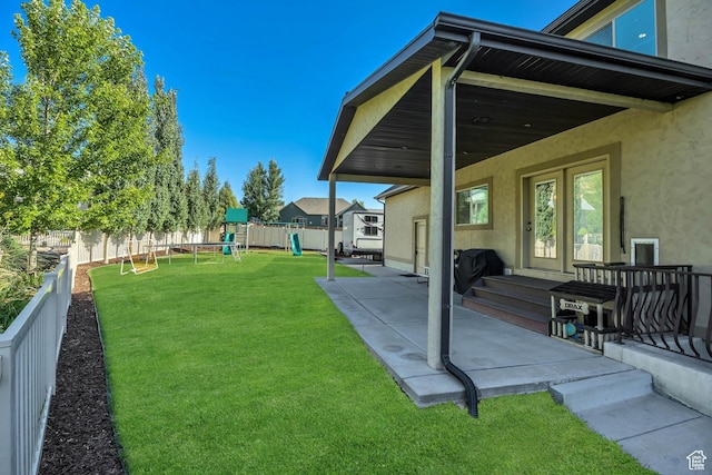 789 Eliza Ct, Farmington, UT 84025 - fenced backyard with a playground and a patio area