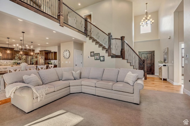 789 Eliza Ct, Farmington, UT 84025 - living room with a high ceiling, a chandelier, recessed lighting, stairs, and light wood finished floors