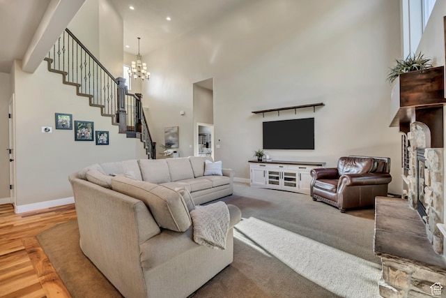 789 Eliza Ct, Farmington, UT 84025 - living area with a towering ceiling, stairway, a fireplace, a chandelier, and recessed lighting