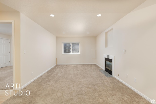 796 N 200 W, American Fork, UT 84003 - unfurnished living room with light colored carpet, a high end fireplace, and recessed lighting