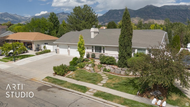 796 N 200 W, American Fork, UT 84003 - view of front of home featuring a garage, concrete driveway, a chimney, and a mountain view