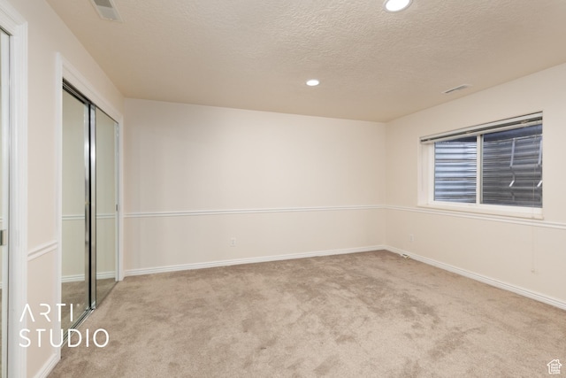 796 N 200 W, American Fork, UT 84003 - unfurnished bedroom with carpet, a textured ceiling, recessed lighting, and a closet