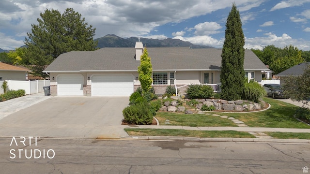 796 N 200 W, American Fork, UT 84003 - single story home featuring an attached garage, concrete driveway, a chimney, and a mountain view