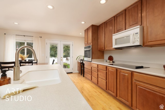 796 N 200 W, American Fork, UT 84003 - kitchen featuring white microwave, black electric cooktop, stainless steel oven, light countertops, and recessed lighting