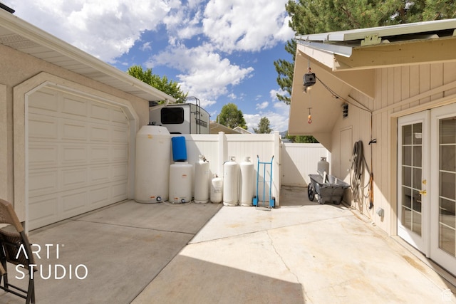796 N 200 W, American Fork, UT 84003 - view of patio / terrace with concrete driveway and french doors