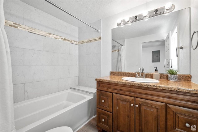 4371 S 200 W, Washington Terrace, UT 84405 - bathroom with shower / tub combo, vanity, a textured ceiling, and wood finished floors