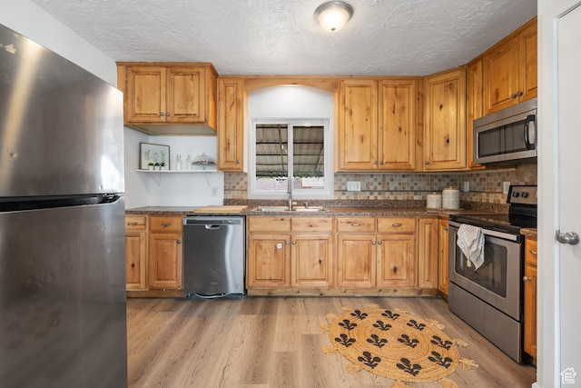 4371 S 200 W, Washington Terrace, UT 84405 - kitchen featuring stainless steel appliances, light wood-style floors, open shelves, a textured ceiling, and backsplash
