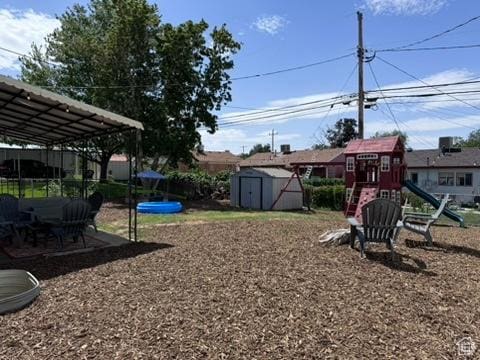 4371 S 200 W, Washington Terrace, UT 84405 - view of yard with a storage unit and a playground
