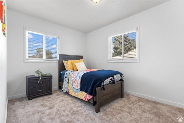4371 S 200 W, Washington Terrace, UT 84405 - bedroom featuring multiple windows and carpet