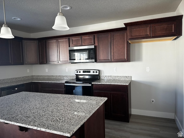 12343 S Varitek Dr, Herriman, UT 84096 - kitchen with stainless steel microwave, electric range oven, light stone countertops, wood finished floors, and a textured ceiling