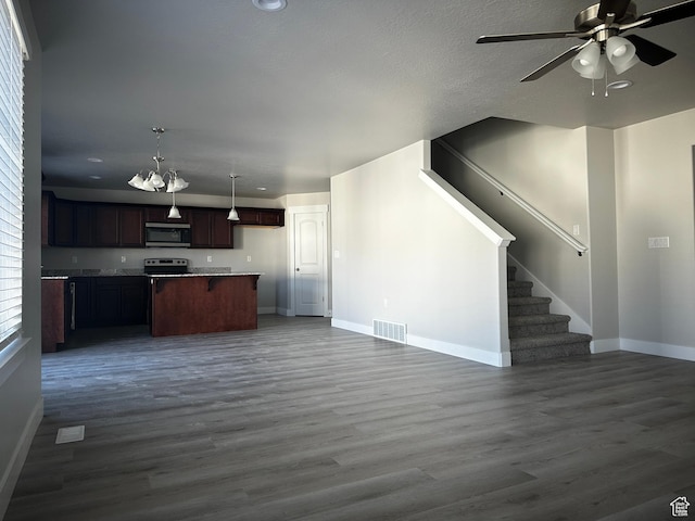 12343 S Varitek Dr, Herriman, UT 84096 - kitchen with open floor plan, appliances with stainless steel finishes, a ceiling fan, dark wood-style floors, and pendant lighting
