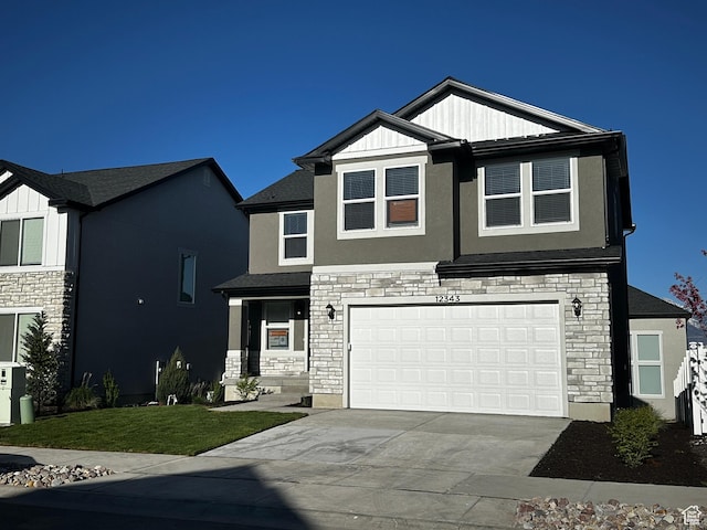 12343 S Varitek Dr, Herriman, UT 84096 - view of front of home with stone siding, concrete driveway, a garage, and stucco siding