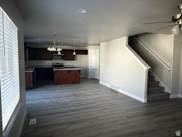 12343 S Varitek Dr, Herriman, UT 84096 - kitchen with appliances with stainless steel finishes, open floor plan, a ceiling fan, dark wood-type flooring, and recessed lighting