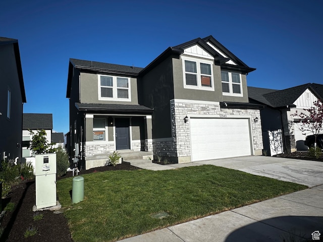 12343 S Varitek Dr, Herriman, UT 84096 - view of front of home with stone siding, stucco siding, driveway, and an attached garage
