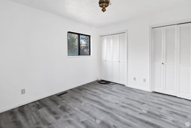 458 E 200 S, Annabella, UT 84711 - unfurnished bedroom featuring two closets and wood finished floors