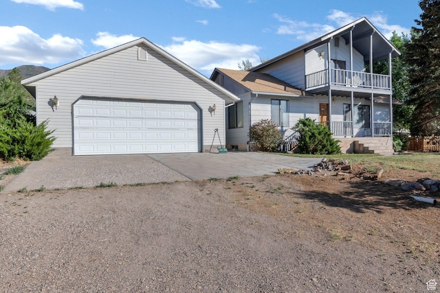 458 E 200 S, Annabella, UT 84711 - view of front of house with a balcony, concrete driveway, and an attached garage