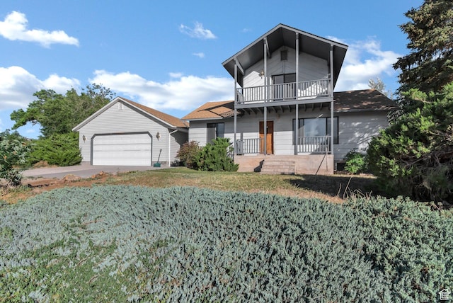 458 E 200 S, Annabella, UT 84711 - view of front facade featuring a balcony, a garage, an outbuilding, covered porch, and a front yard
