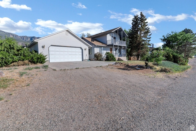 458 E 200 S, Annabella, UT 84711 - view of front facade with driveway, an attached garage, a balcony, and a mountain view