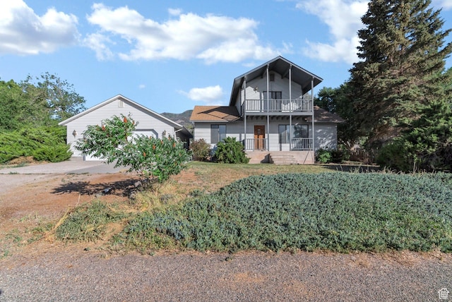 458 E 200 S, Annabella, UT 84711 - traditional home with a balcony, concrete driveway, and a garage