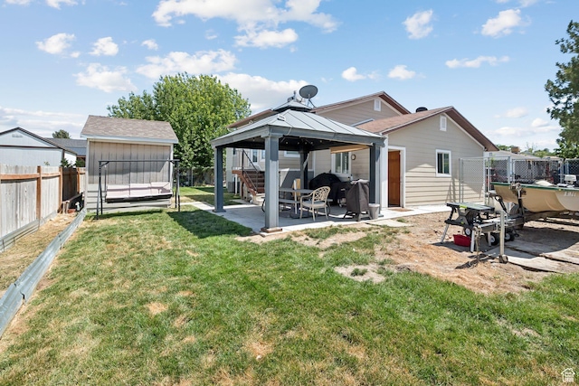 4807 S Heath Ave W, Salt Lake City, UT 84118 - rear view of property with a gazebo, a patio, a fenced backyard, and a storage shed