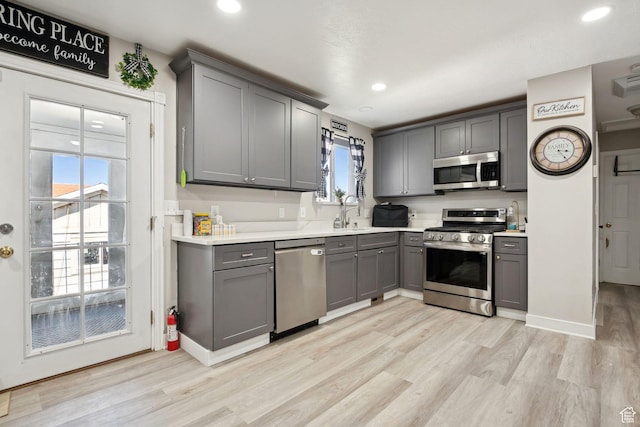 4807 S Heath Ave W, Salt Lake City, UT 84118 - kitchen with stainless steel appliances, gray cabinets, light wood-style floors, light countertops, and recessed lighting