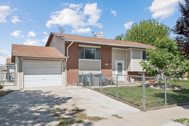 4807 S Heath Ave W, Salt Lake City, UT 84118 - bi-level home with brick siding, driveway, a garage, and a fenced front yard