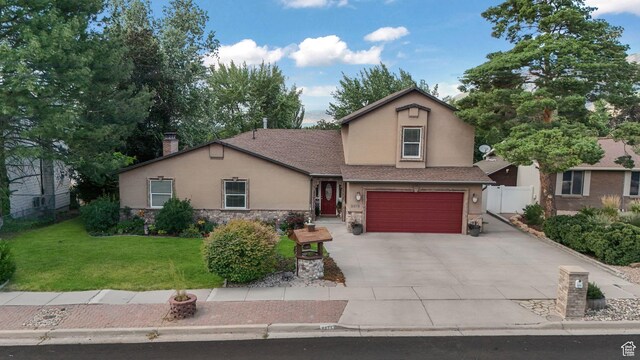2275 E 9800 S, Sandy, UT 84092 - view of front facade featuring stucco siding, stone siding, an attached garage, driveway, and a chimney