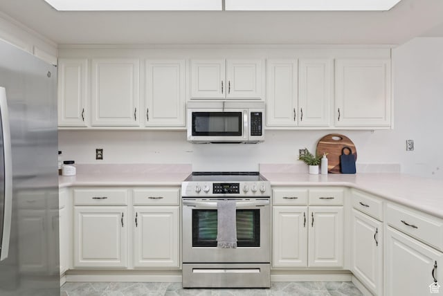 48 W 300 S Unit 1405N, Salt Lake City, UT 84101 - kitchen with appliances with stainless steel finishes, white cabinetry, and light countertops